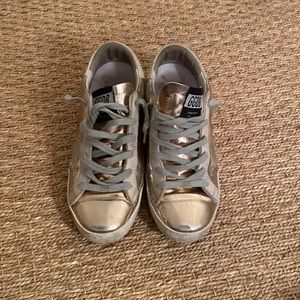 Size 35 rose gold super stars. Worn but good condition